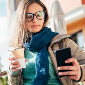 woman looking at her smart phone